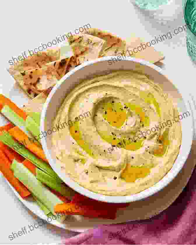 A Bowl Of Hummus, A Traditional Arab Appetizer Made From Chickpeas, Tahini, And Olive Oil. Arabiyya: Recipes From The Life Of An Arab In Diaspora A Cookbook