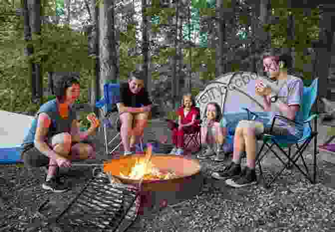 A Family Camping In A Forest, Gathered Around A Campfire, With Tents Pitched In The Background The Ride Of Our Lives: Roadside Lessons Of An American Family