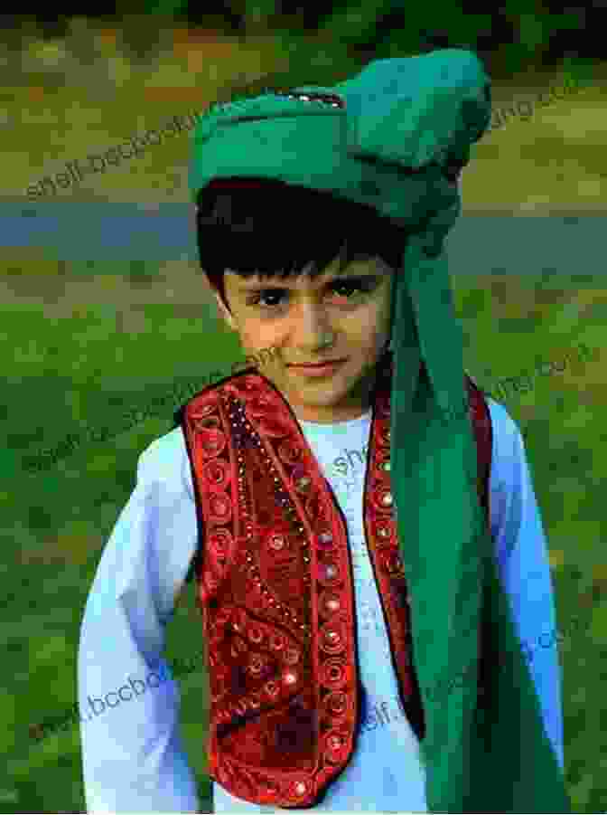 A Photo Of The Author, A Young Boy In Traditional Afghan Clothing, Standing In Front Of The White House. The Envoy: From Kabul To The White House My Journey Through A Turbulent World