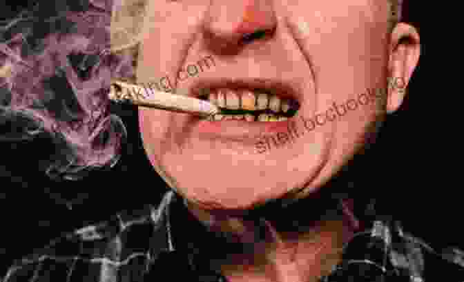 A Photograph Of A Young Man With A Cigarette In His Mouth, Looking Defiant. Look Back In Anger John Osborne