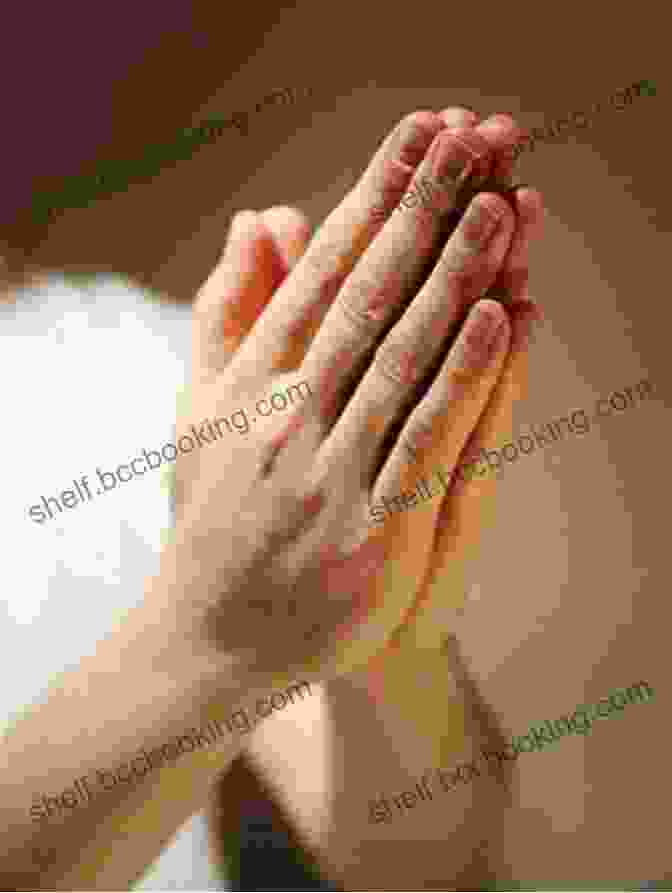 Close Up Of A Person's Hands Clasped In Prayer More Grace JD Brown
