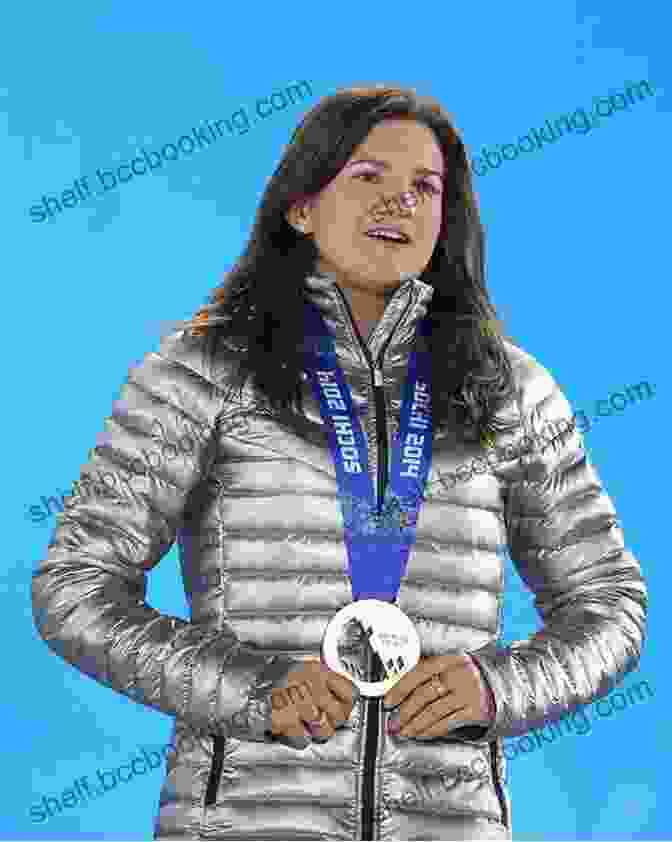 Kelly Clark Proudly Displaying Her Olympic Gold Medal, A Testament To Her Unwavering Determination Reaching New Heights: The Kelly Clark Story (ZonderKidz Biography)