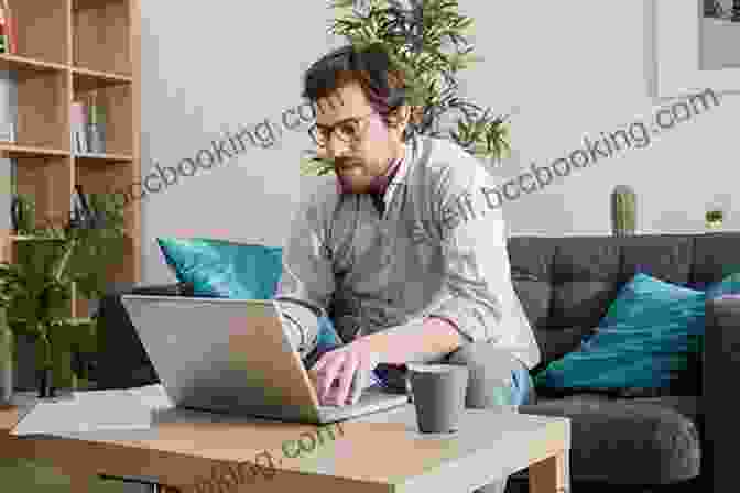 Man Working Remotely On A Laptop In A Cozy Home Office Remote: Office Not Required Jason Fried